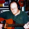 John recording an acoustic guitar track for the Keys Disease CD in his studio, Radio Active Productions.